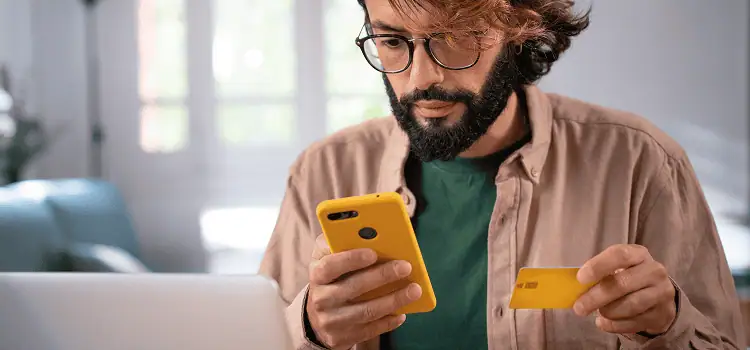 man-shopping-online-paying-using-credit-card-and-s